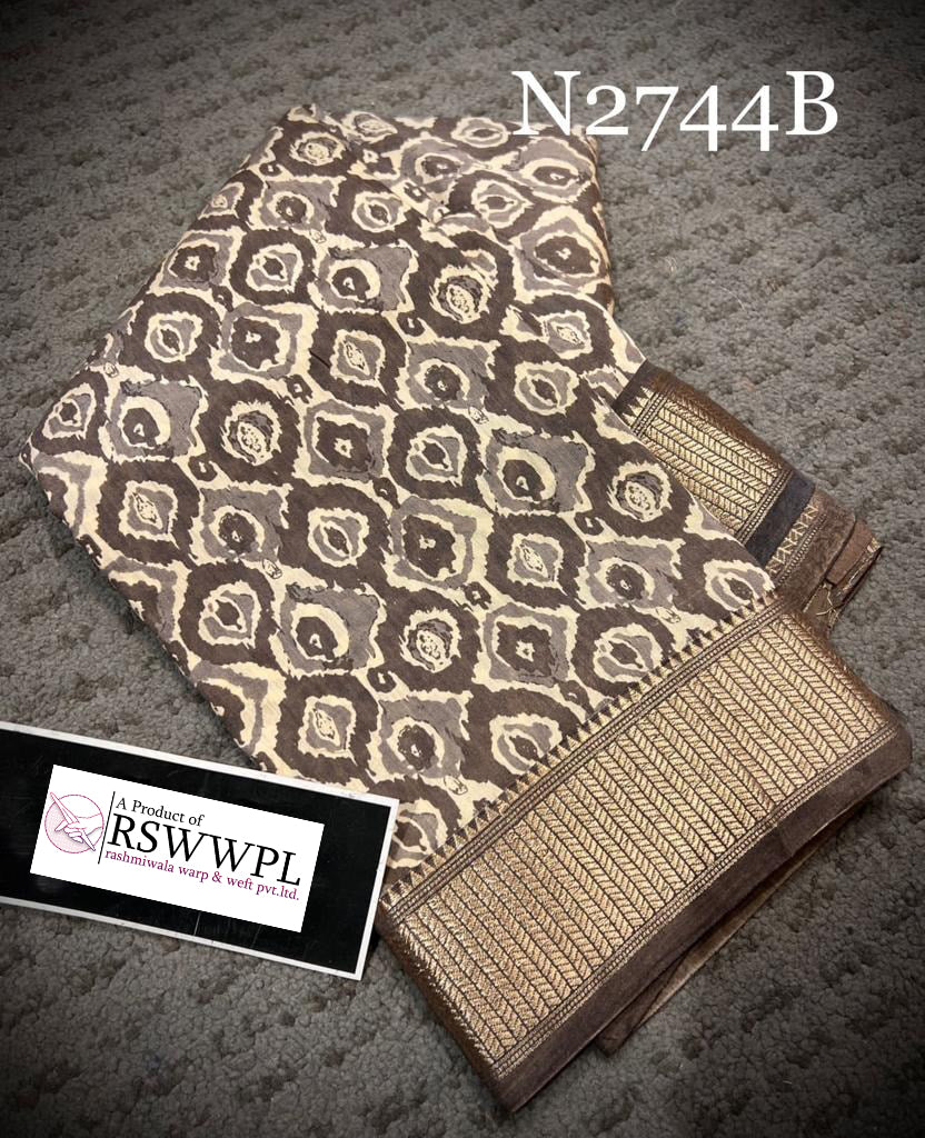 Elegant brown Dola silk saree with beautiful prints, combining traditional charm and modern elegance