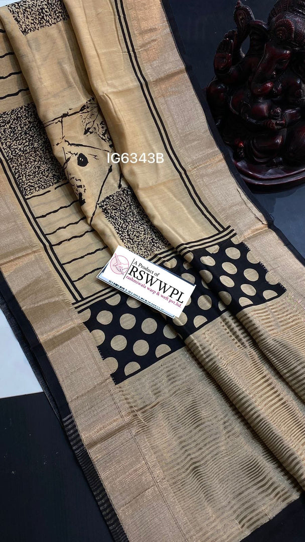 Light Brown Lightweight, soft Assam silk with woven border and beautiful prints.