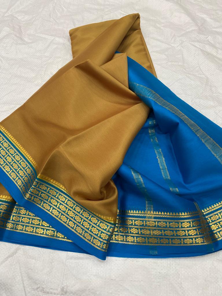 Opulent Gold And Navy Blue Traditional Semi Soft Silk Saree With Fine Zari Border