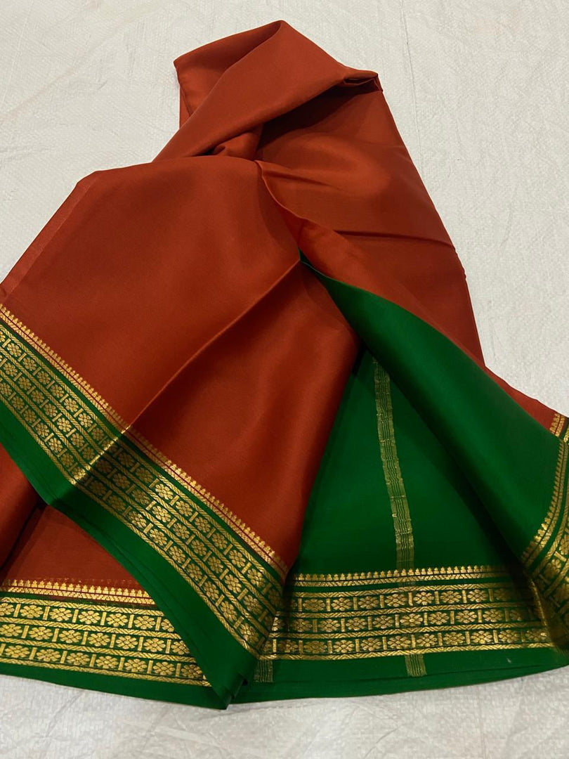 Rich Red And Light Green Semi Soft Silk Saree With Intricate Zari And Ethnic Touch