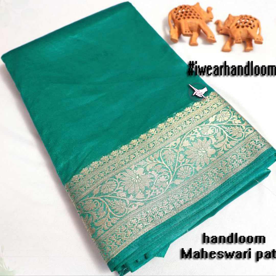 Engaging Teal Elegance Tissue Weaving Silk Saree