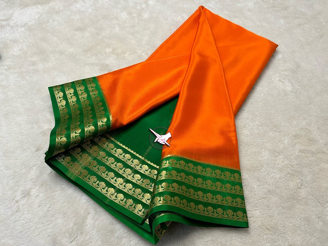 Soft And Smooth Orange And Green Mysore Silk Saree With Traditional Zari Edging
